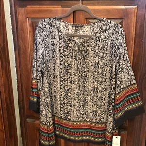 Women’s blouse black and white and multicolor.